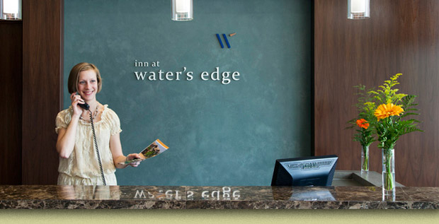 College of Dupage Waters Edge Logo Applied to a Wall Behind the Reception Desk